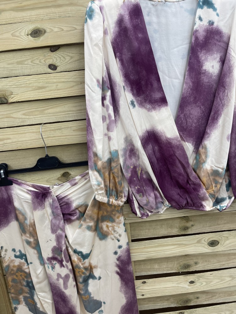 Conjunto de blusa y falda con nudo