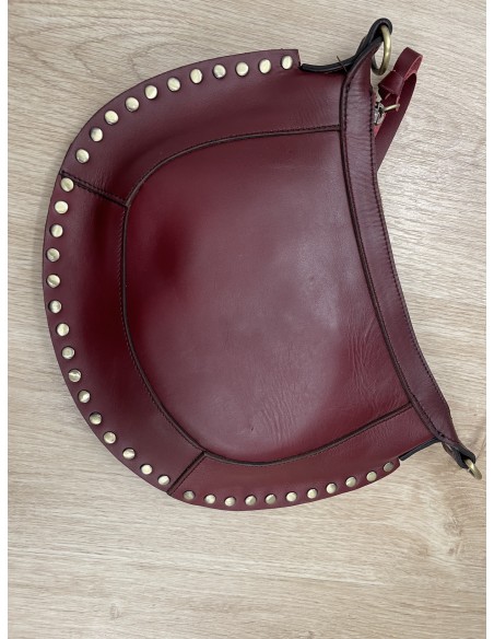 Bolso bandolera con borde de tachas
