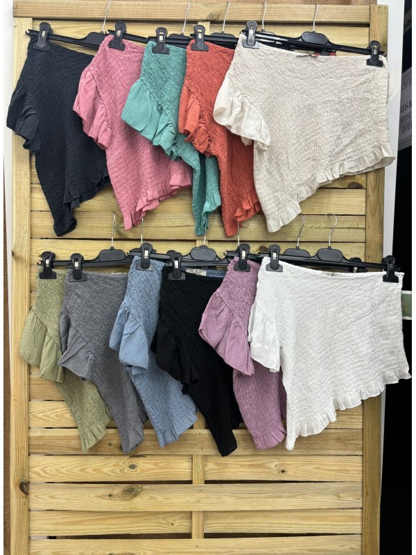 Camisa asimetrica fruncida con volantito