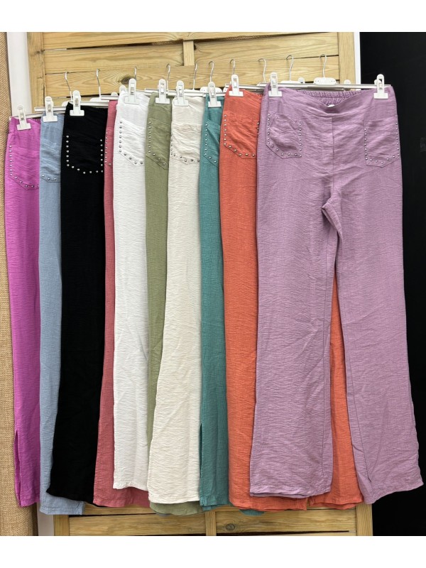 Pantalon tachuelas bolsillo y raja lateral