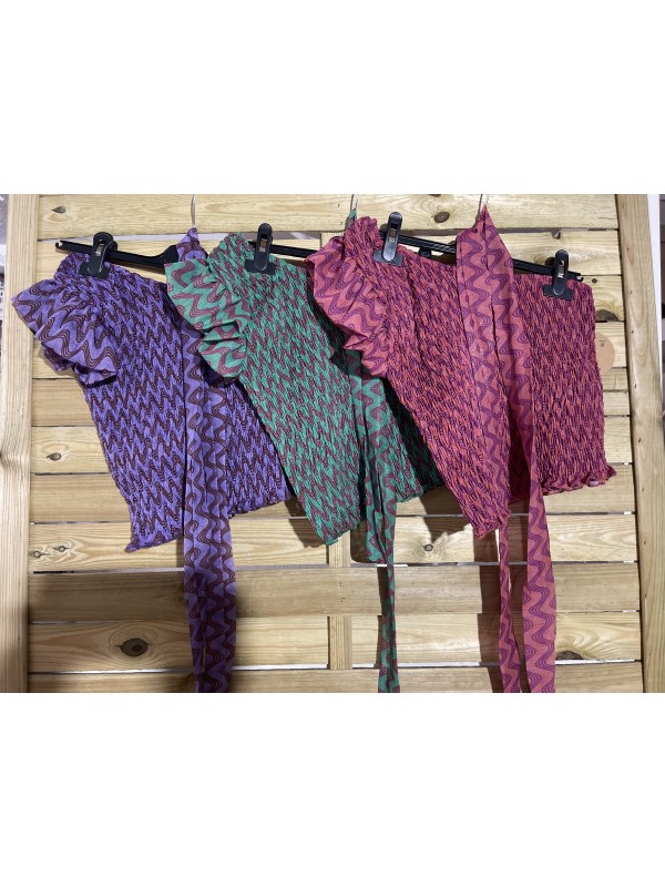 Top asimétrico ondas con brillito y lazo